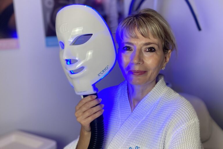 Woman during a cryo facial treatment session