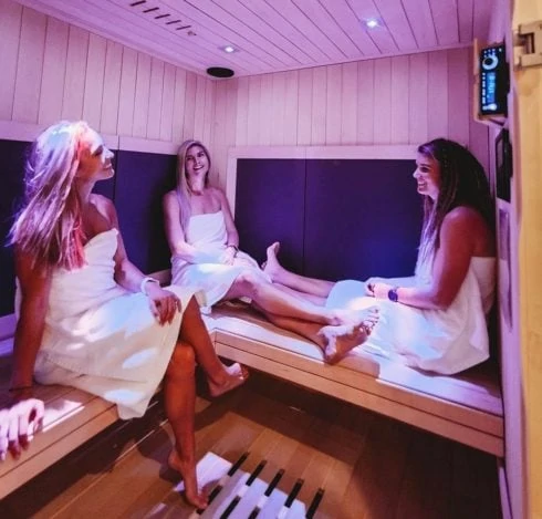 Group of women socializing in Infrared Sauna.