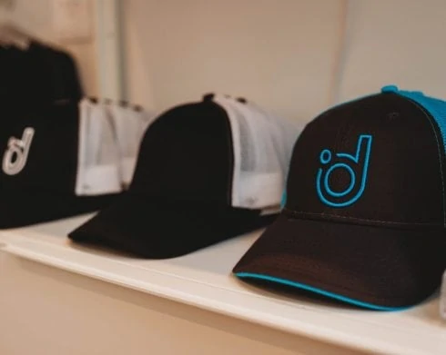 Degree Wellness hats.