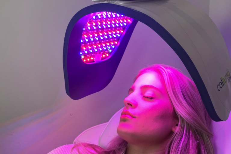 Woman relaxing during her Celluma Light Facial to improve fine lines and uneven skin