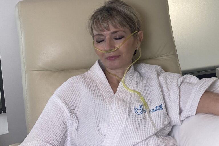 Female relaxing during her Oxygen Therapy session